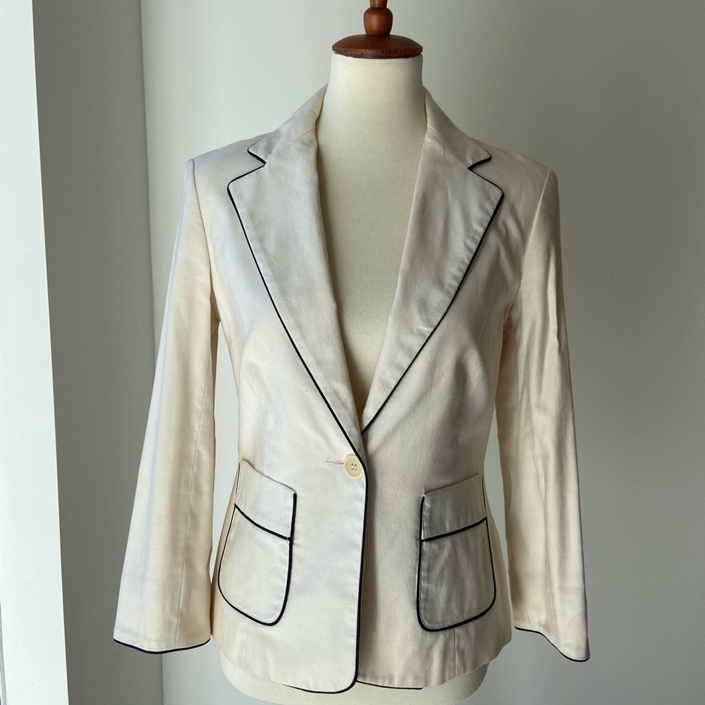 Cute Club Monaco cream stretch cotton jacket with 3/4 sleeves and black piping.